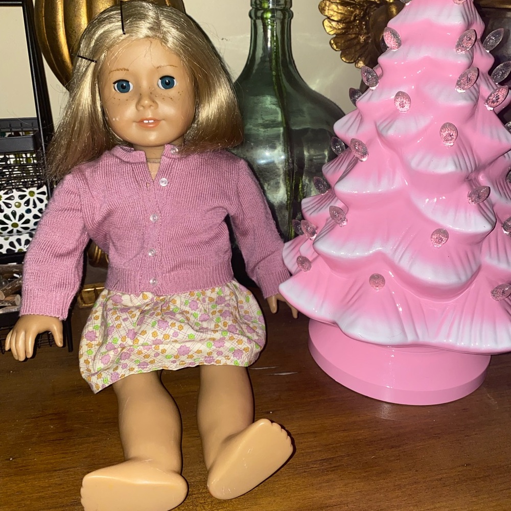 American Girl Doll with Pink Sweater and Floral Skirt